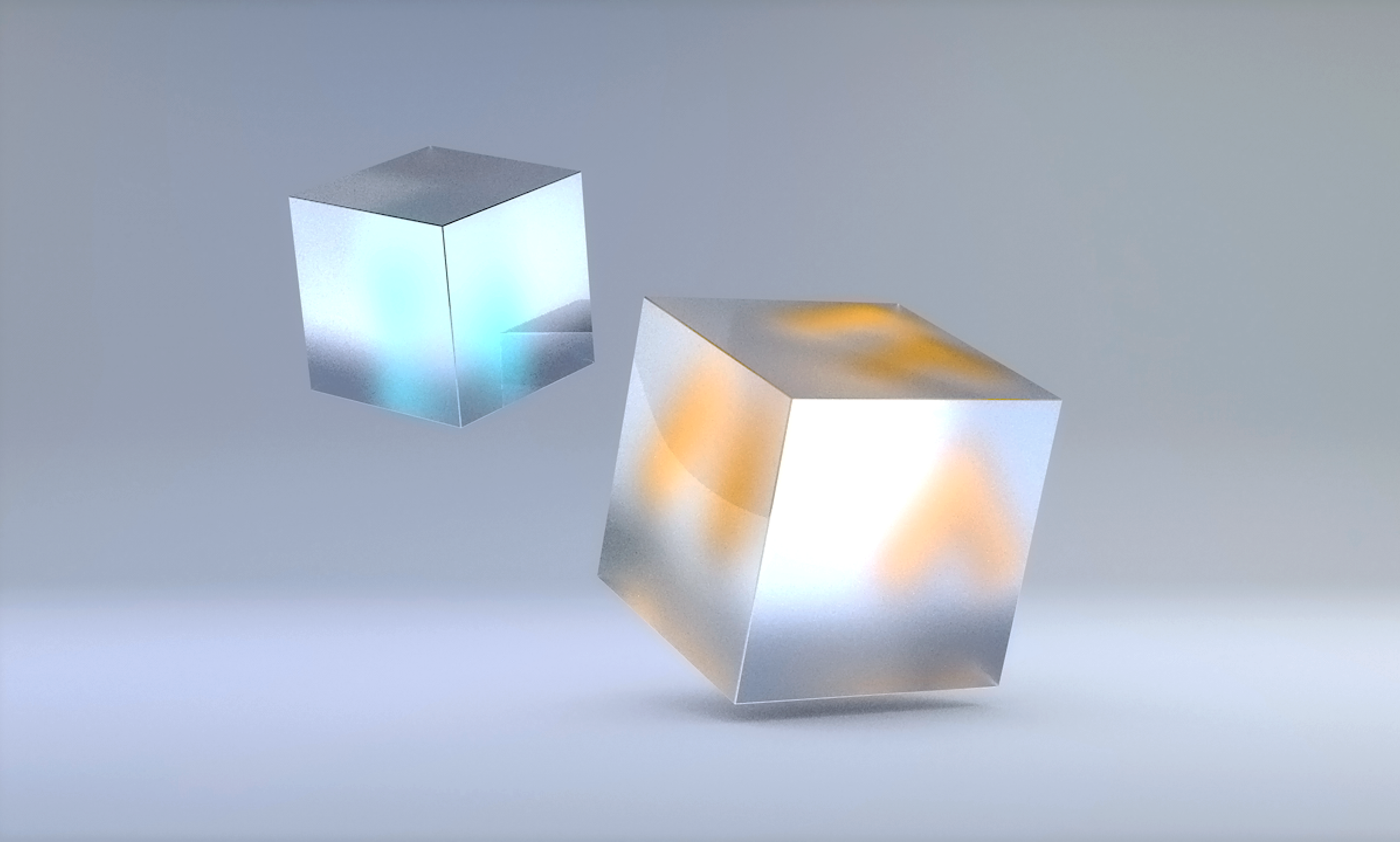 A floating orange cube and blue cube on a grey background