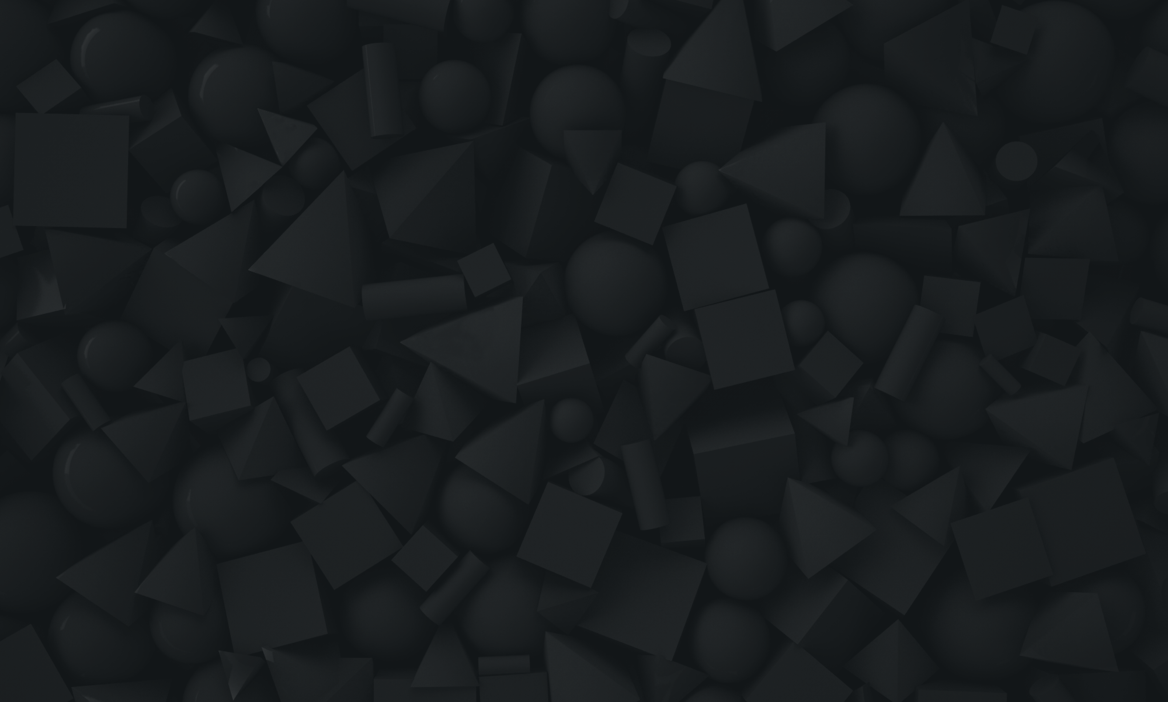 small scattered charcoal 3d shapes on a black background